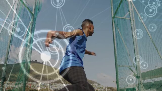Male discus thrower entering ring rotating and throwing, sports training in net with target overlay