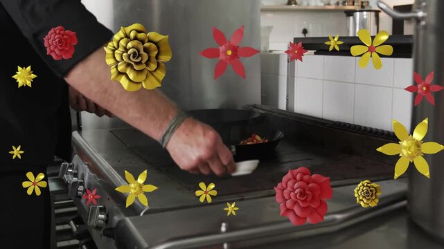 Male chef pouring ramekin into pan in kitchen causing floral overlay managing flame finishing dish
