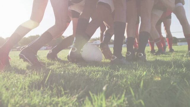 Loose ball rolling soccer players converging competing for ball while digital stripes overlaying