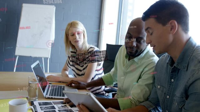 Team reviewing design after tablet scan, lead pointing at laptop while UI overlays appearing