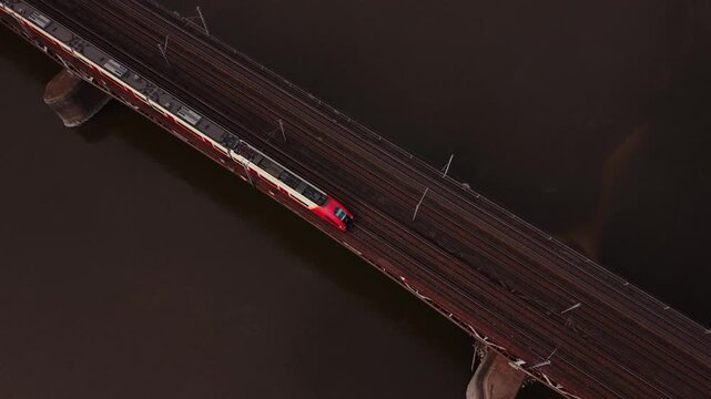 Aerial View Two Trains Passing Bridge Warszawa With Parallel Tracks, Silver Express Overtaking Red Local, Dynamic Motion And Speed, River Below, Modern Transit Corridor, Engineering