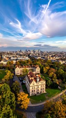 Obraz premium Aerial view of a large building surrounded by trees and a cityscape