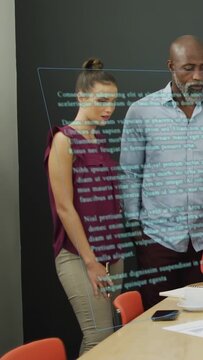Vertical video: Woman tapping AR panel, swiping text and making business edits while man watches
