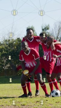 Vertical video: Soccer team of 4 linking arms, kicking ball sparking cup reveal, gold nodes overlay