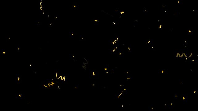 Confetti fired in the air during a party. Only confetti on black background of the night. 