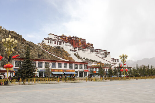 Potala Palace in Lhasa, Tibet above city plaza and mountain slope