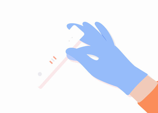 A gloved hand holds a covid 19 rapid antigen test cassette