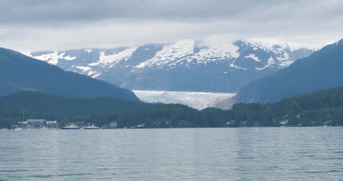 Mendenhall Glacier and the surrounding mountains covered by clouds, Alaska.
