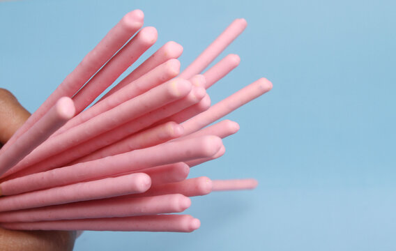 close up creamy biscuits stick with blue background