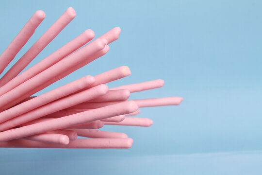 close up creamy biscuits stick with blue background