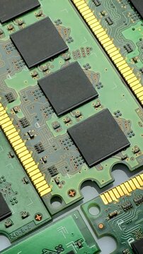 Electronic printed circuit boards with memory chips close-up. Vertical video