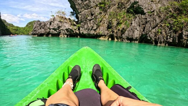 POV kayaking, clear lagoon, legs covered to avoid sunburn El Nido Philippines