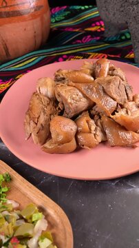 Aerial view of Traditional Mexican street food. Pork carnitas with pork rind (cueritos)