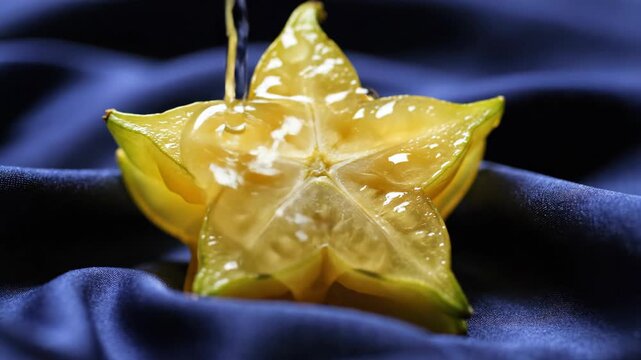 Pouring water onto a fresh star fruit