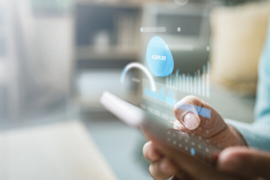 User using smartphone with financial dashboard, tracking personal expenses, budget, and spending analytics, representing mobile finance management, digital banking, and real time money tracking.