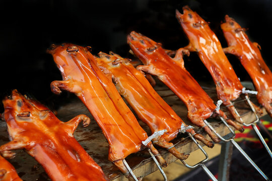 suckling pig in the restaurant being grilled