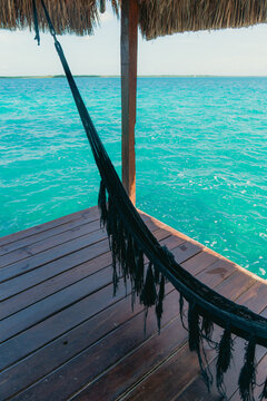 a hamock next to the lagoon in bacalar mexico