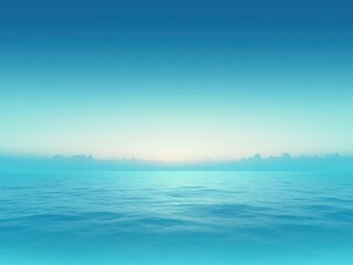 Obraz premium Calm open sea at dawn with gentle ripples, distant low clouds and a soft glowing blue horizon conveying peaceful serenity