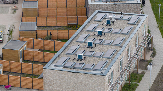 Aerial View of Rooftops with Heat Pumps and Clean Energy
