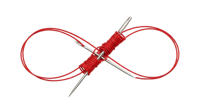 Red yarn and knitting needles in infinity loop formation