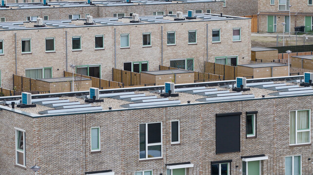 Aerial View of Rooftops with Heat Pumps and Clean Energy