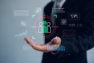 Obraz premium Business professional analyzing target audience and data analytics interface, highlighting customer segmentation, AI technology, marketing strategy, digital business intelligence concept.