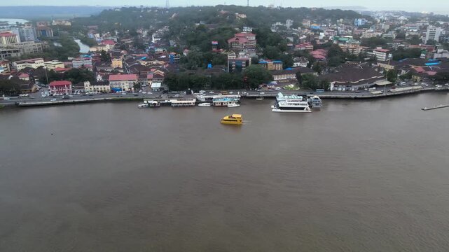 Aerial View of Mandovi River with Ferry and Panaji Cityscape Goa India