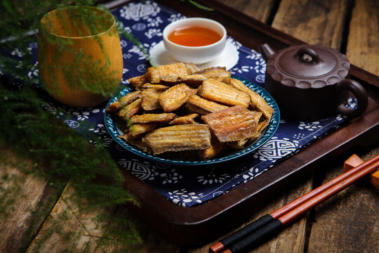 Crispy Fried Hairtail Fish with Tea in Asian Table Setting