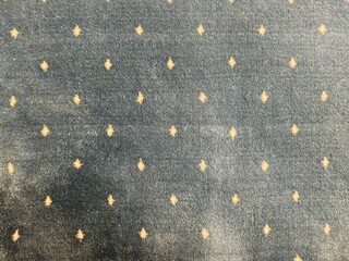 Fototapeta premium Gray carpet texture with small yellow motifs
