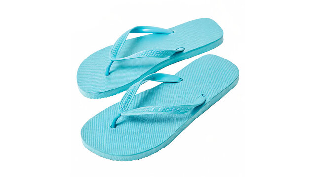 Bright turquoise flip flops are placed together on a flat surface ready for summer outings or beach activities