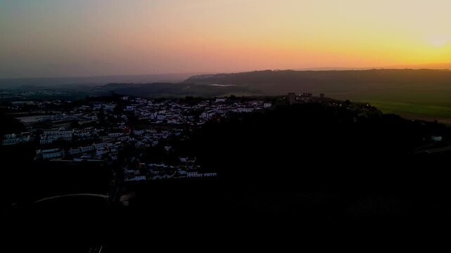 Sunset over historic Obidos castle in Portugal, scenic tranquil view