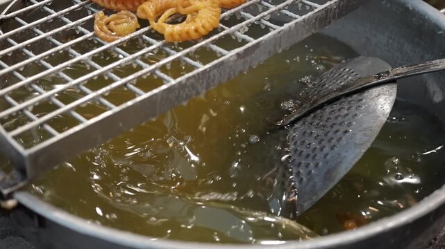 Imarti or jalebi an indian dessert fried in oil then dipped in sugar syrup
