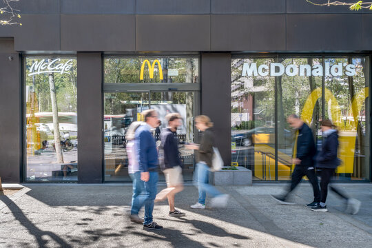 McDonalds Restaurant Entrance with Blurred People in Barcelona, Spain