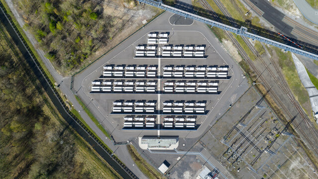 Aerial view of RWE Westfalen power plant with rows of battery storage units and industrial infrastructure in Hamm, Nordrhein-Westfalen, Germany.