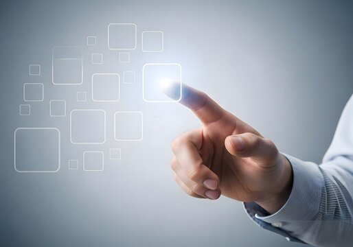 Hand in a business shirt interacting with a virtual interface of glowing squares on a gray background