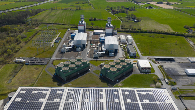 Aerial view of the Trianel Gaskraftwerk Hamm power plant featuring industrial buildings, cooling towers, and a large solar panel array in Hamm, Nordrhein-Westfalen, Germany.