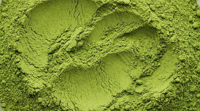 Vibrant Green Powder: The image showcases a close-up of a vibrant green powder, with a fine, textured consistency.
