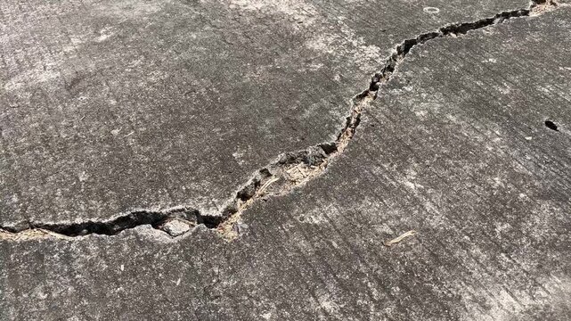 Severe Cracks on Concrete Road Surface