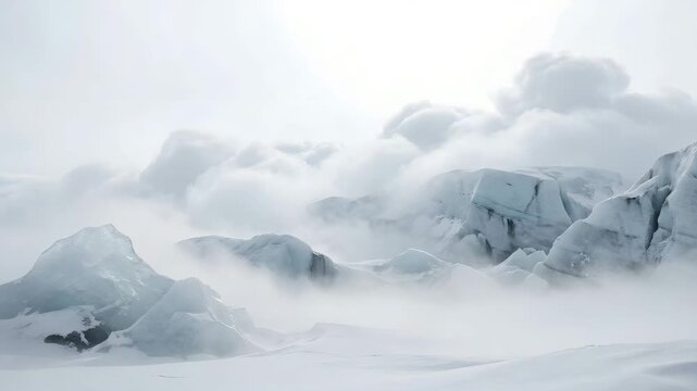 Serene glacial landscape shrouded in fog and clouds conveying peaceful isolation.