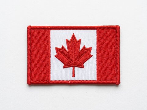 Embroidered Canadian flag patch with red maple leaf on white.