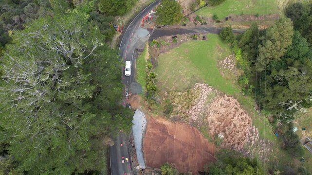 Dorne footage from above of re-building New Zealand roads being destroyed by extreme weather, cyclones and climate change in the pacific islands.