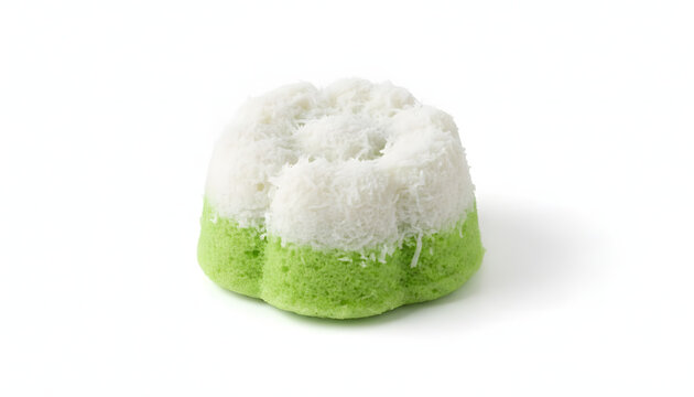 Beautiful Indonesian Kue Putu Ayu, a soft, green, flower-shaped pandan steamed sponge cake topped with fresh grated coconut