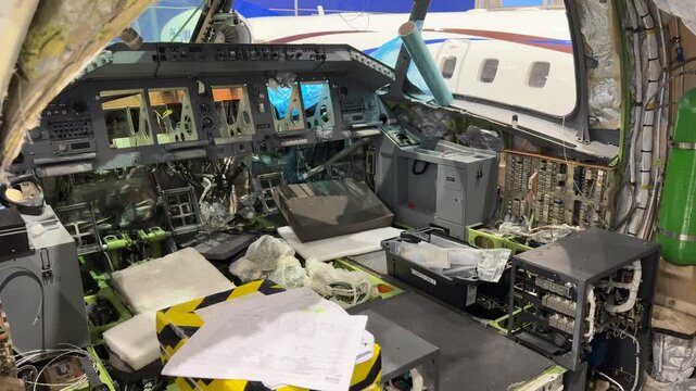 Stripped-Down Interior Cockpit of Commercial Airplane in Maintenance