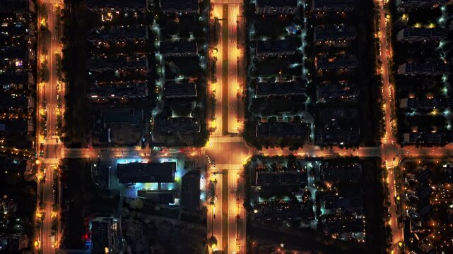 time lapse of traffic in modern city at night, aerial view