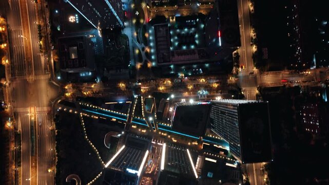 time lapse of traffic in modern city at night, aerial view