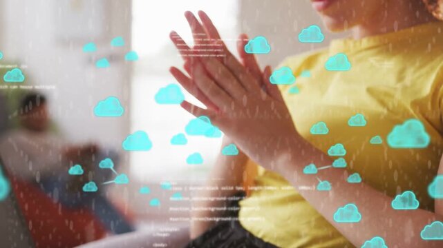 Woman typing laptop starting cloud code overlay clapping hands enlarging overlay reading tech data