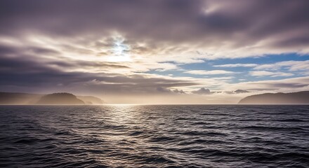 Obraz premium Dramatic seascape at sunset with moody sky and horizon scenic landscape