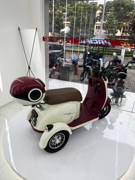 Tangerang, Indonesia on 19 July 2025: white pacific crosser vx ev bike on display at Pacific Gading Serpong store. three-wheeled electric motorcycle. an electric scooter on sale