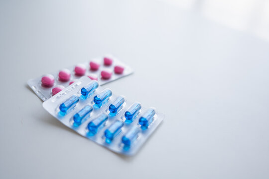 pills and capsules on white background Medical and pharmaceutical concept representing healthcare treatment prevention and wellness