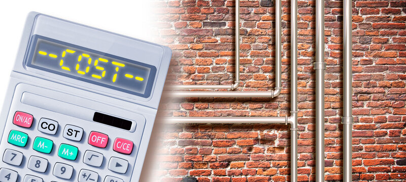 Costs about construction of gas and water pipes - concept with calculator and cost text against a brick wall